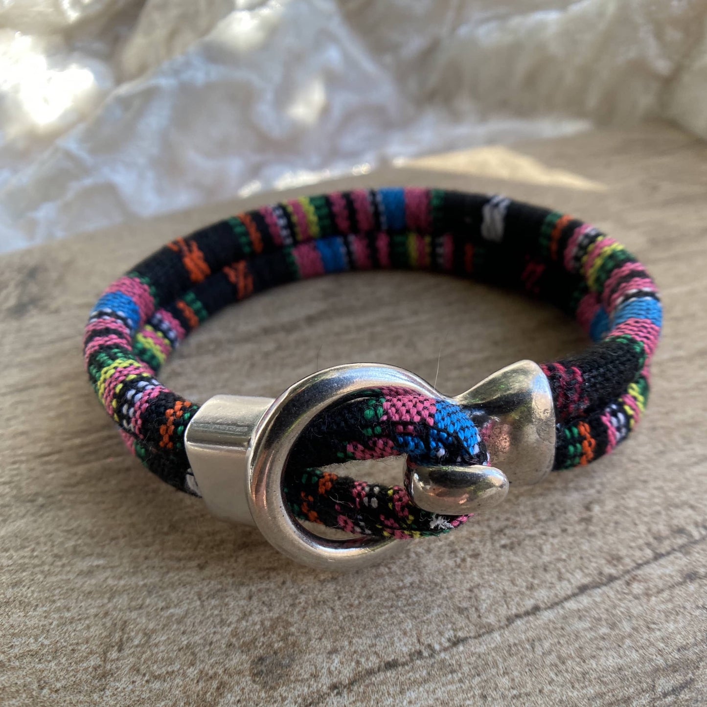 Multi colored corded bracelet with silver